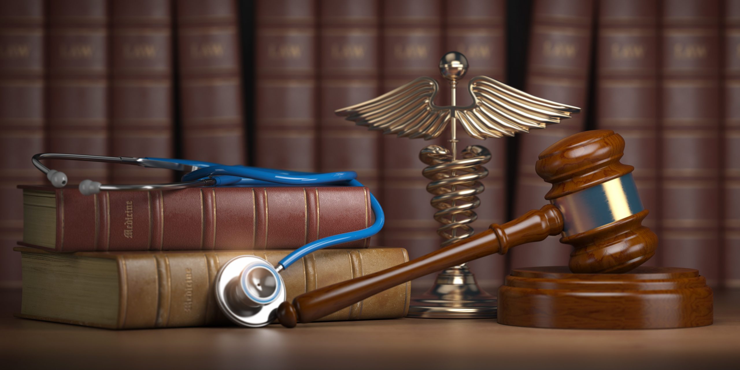 Personal Injury Attorney Michael Fayard Gavel, stethoscope and caduceus sign on books background. Mediicine laws and legal, medical jurisprudence. Personal Injury Attorney Michael Fayard Gavel, stethoscope and caduceus sign on books background. Medicine laws and legal, medical jurisprudence.